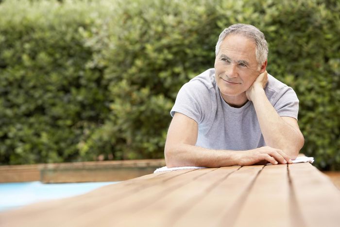 a man contemplating his backyard