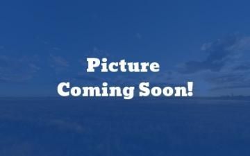 Blue ocean background with centered white text reading “Picture Coming Soon!”