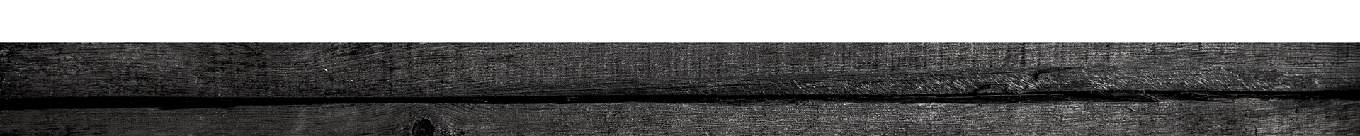 Dark gray textured stone or concrete surface with a horizontal seam at the bottom