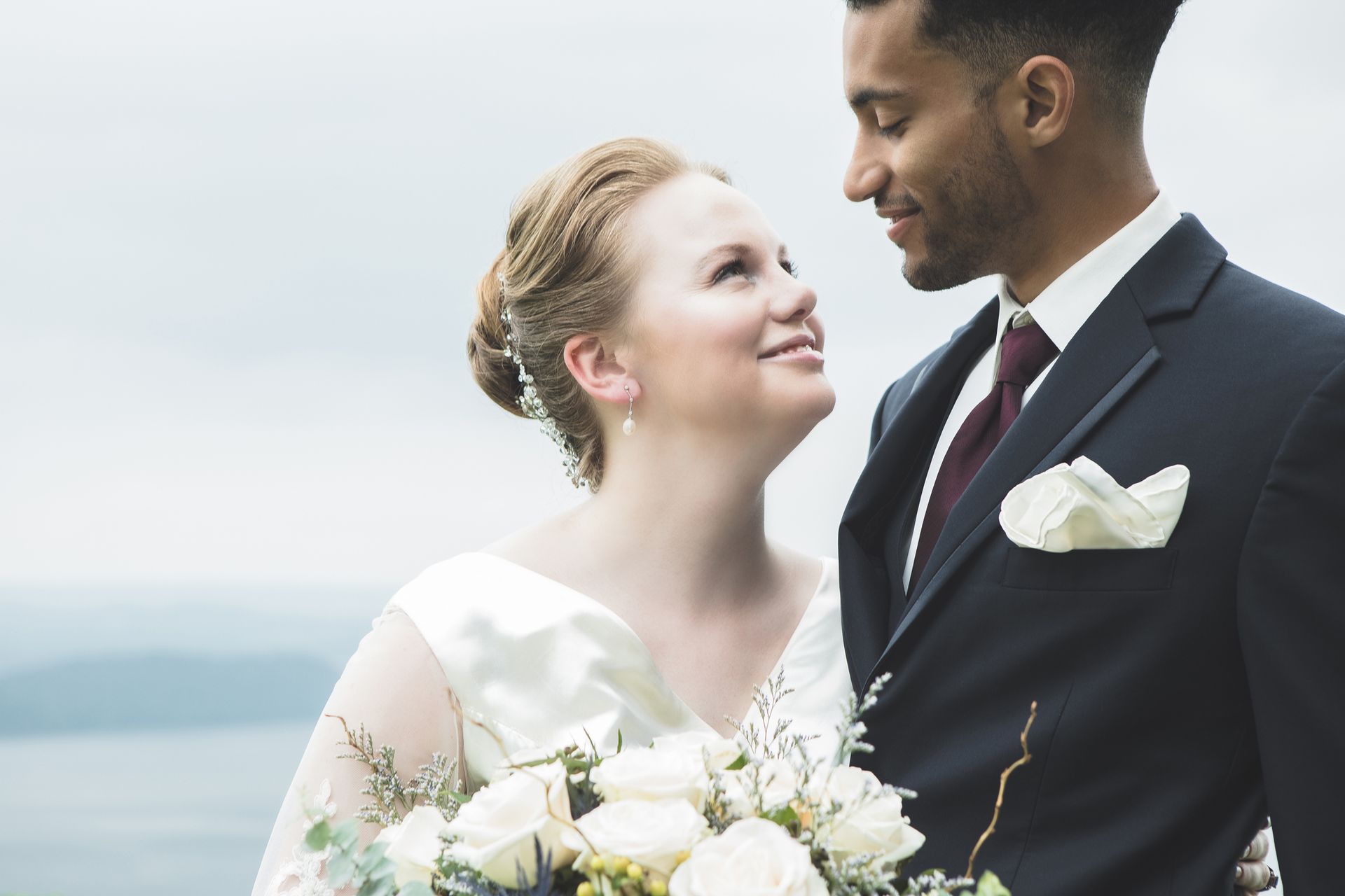Bride and Groom Are Standing Next to Each Other — Charlotte, NC — Mackins Bridal Boutique