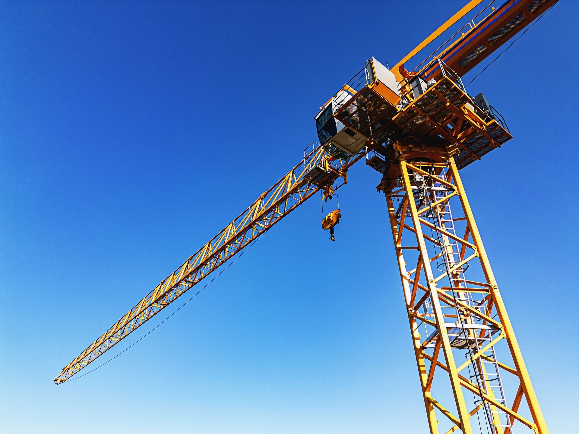 An aerial view of a tower crane on a construction site An aerial view of a tower crane on a construction site