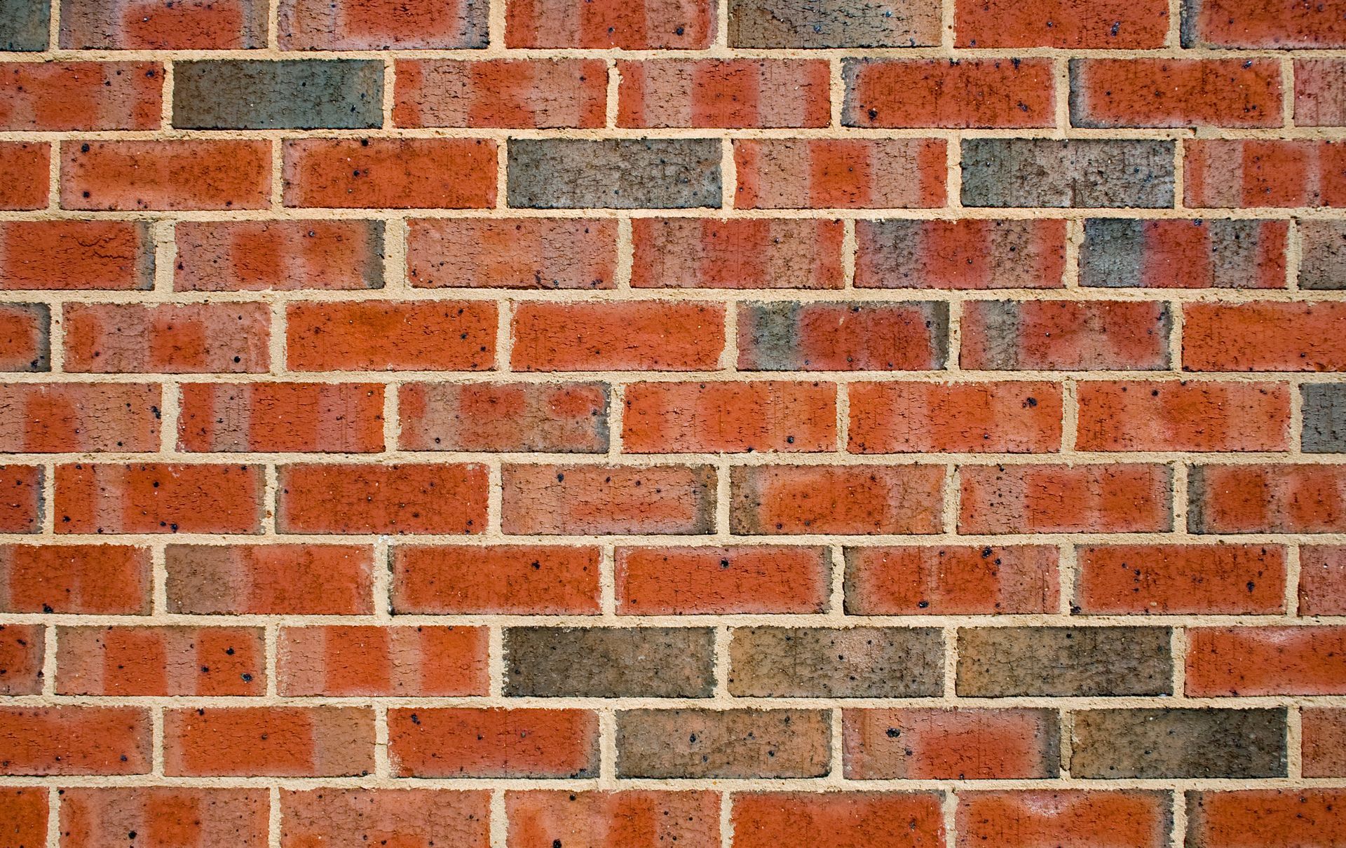 A complete shot of a red brick wall. A complete shot of a red brick wall.