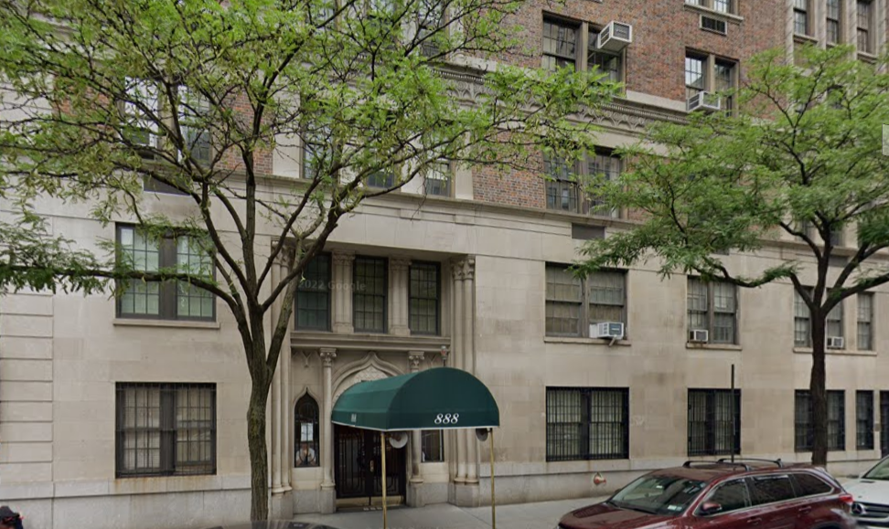 A building with a green awning over the entrance