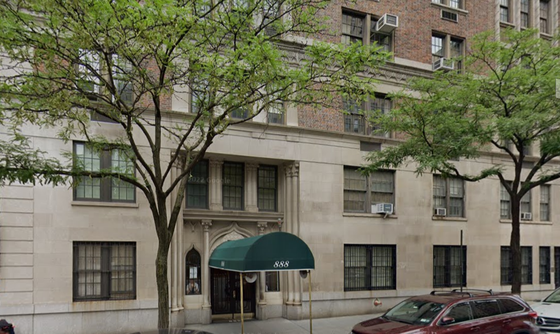A building with a green awning over the entrance