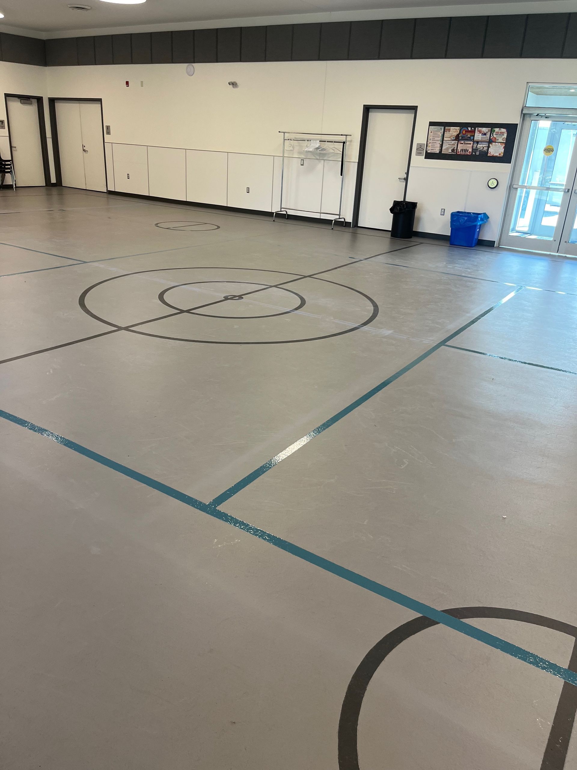 A basketball court with a circle drawn on the floor
