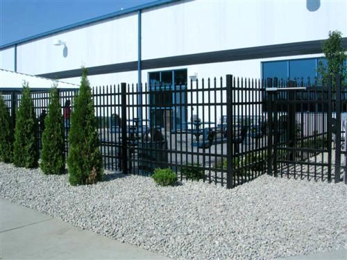Black metal fence around a building