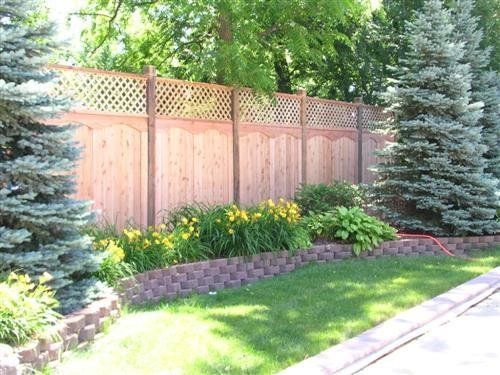Wooden fence with lattice top