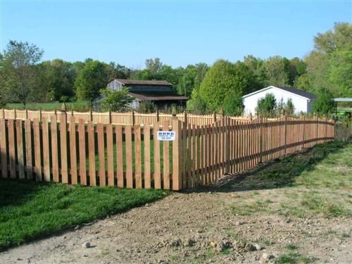 Wooden picket fence encloses