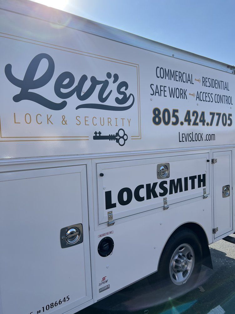 A white truck with the word locksmith on it