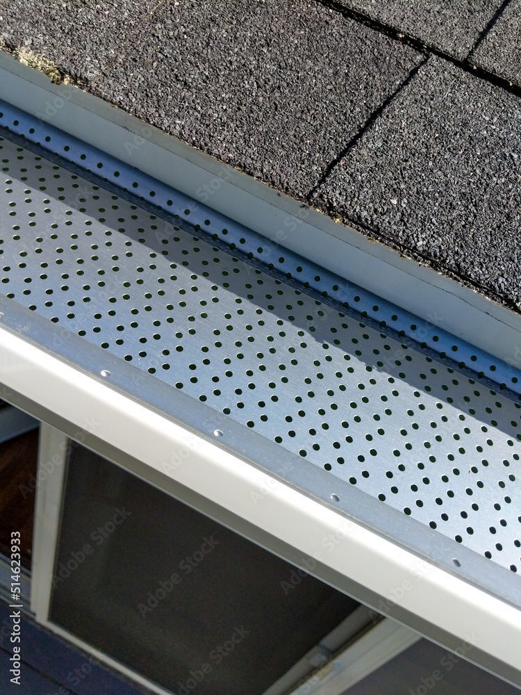 Adjusting Plastic Gutter Guards — Akron, OH — D&M Roofing LLC
