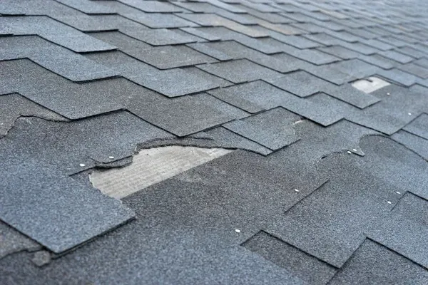 Worker With White Gloves Replacing Gray Tiles — Akron, OH — D&M Roofing LLC