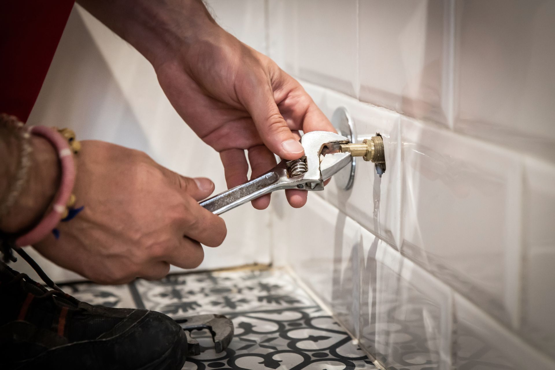 Worker Fixing a Water Stopcock — Cape Coral, FL — Premier Plumbing Patrol