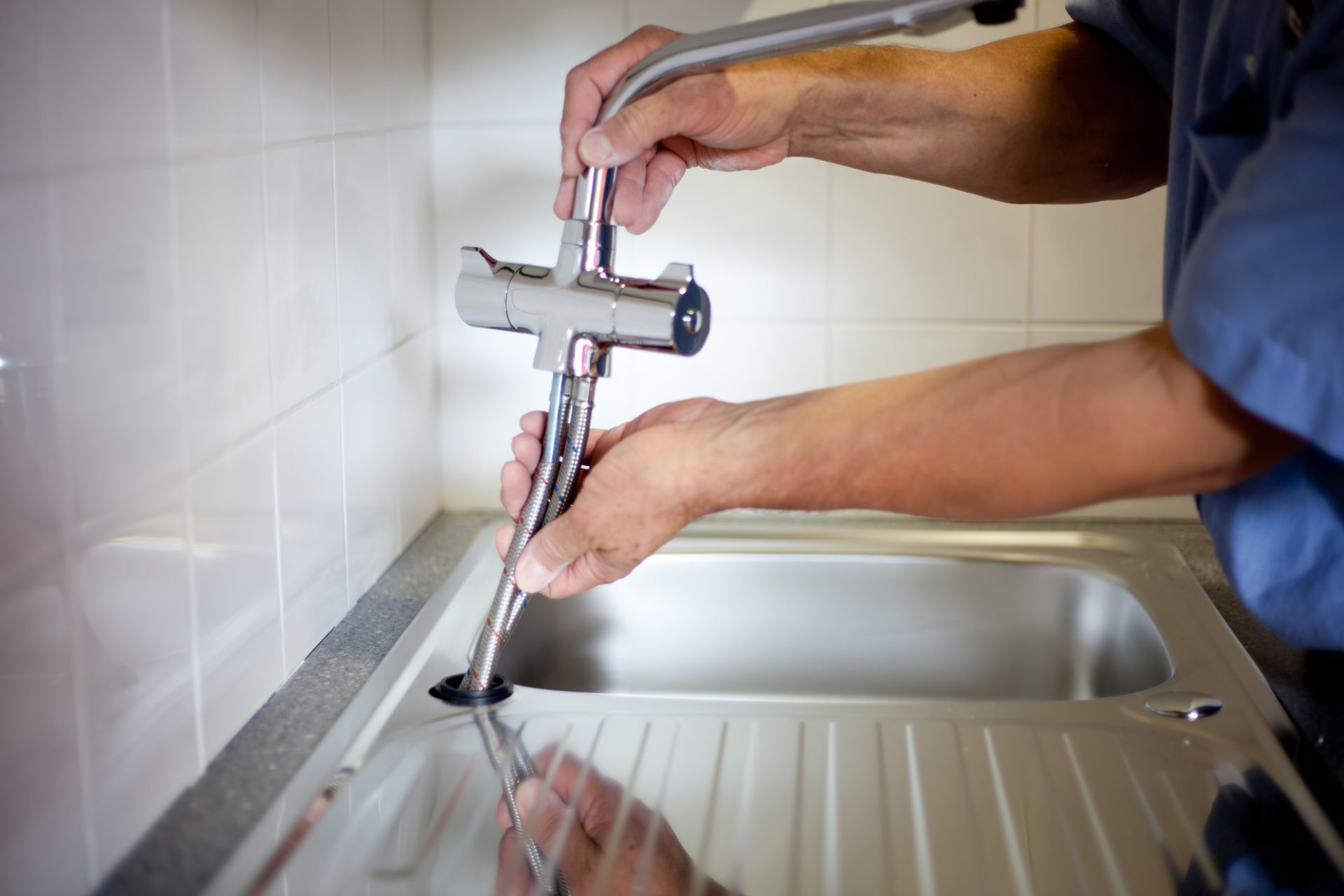 Worker Installing New Tap — Cape Coral, FL — Premier Plumbing Patrol