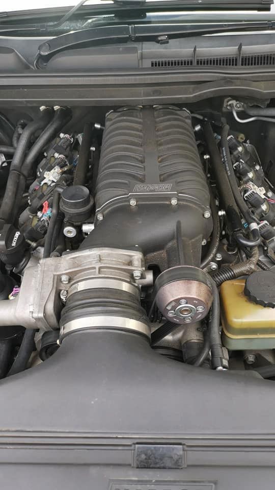 A Car Engine Bay, Showcasing a Black Supercharger With Attached Components — D R Automotive in Russell Vale, NSW