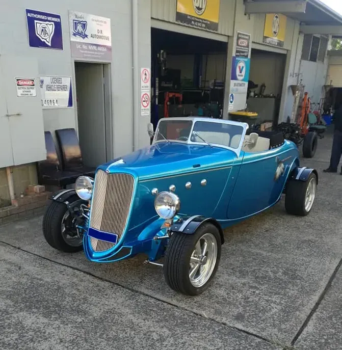 A Blue Hotrod Convertible Parked Outside A Mechanical Workshop — D R Automotive in Russell Vale, NSW