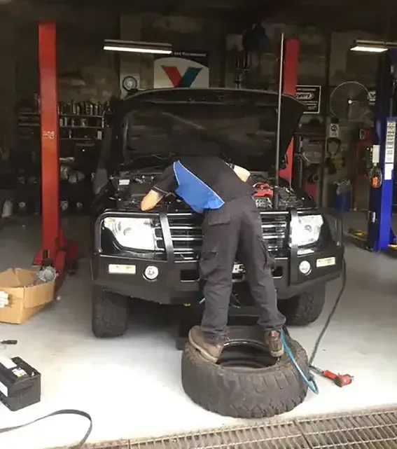 A Mechanic Inspecting a 4WD in a Workshop — D R Automotive in Russell Vale, NSW