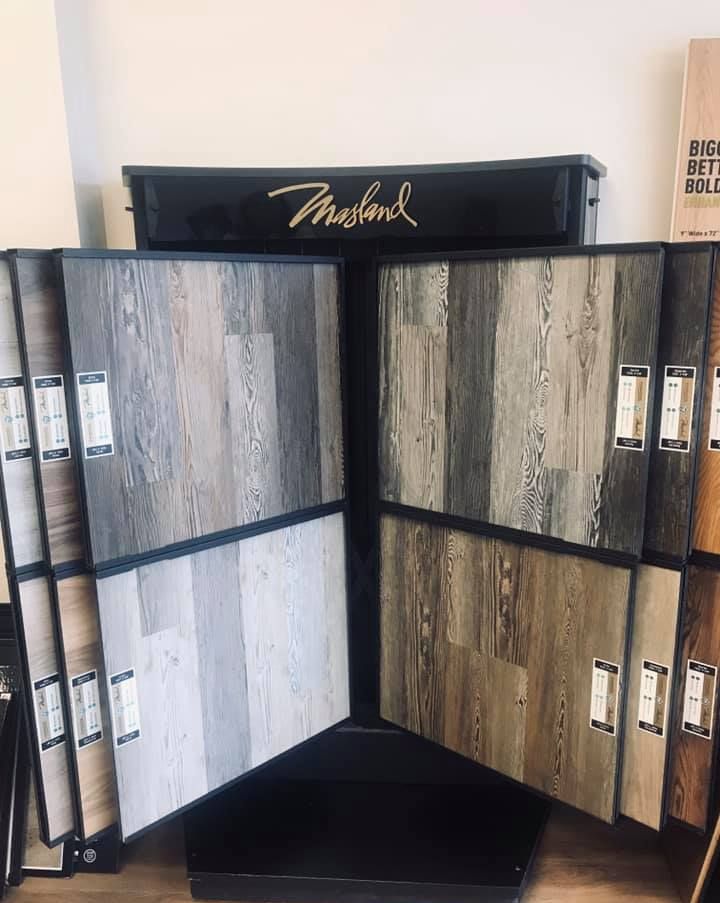 A display of different types of flooring in a store.