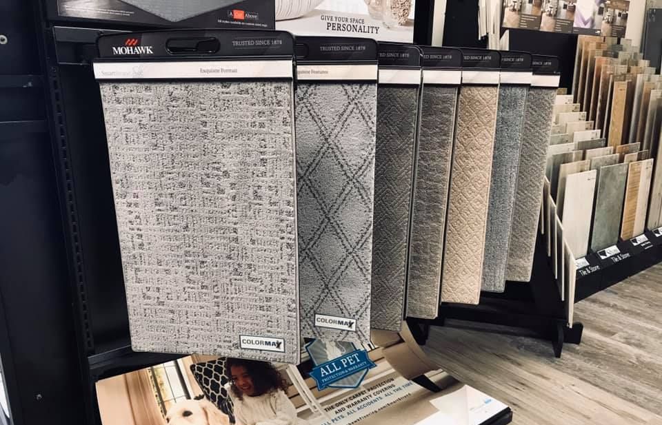 A display of carpets and tiles in a store.