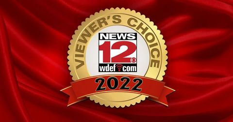 News 12 WETM.com 2022 Viewers’ Choice gold seal on red fabric background