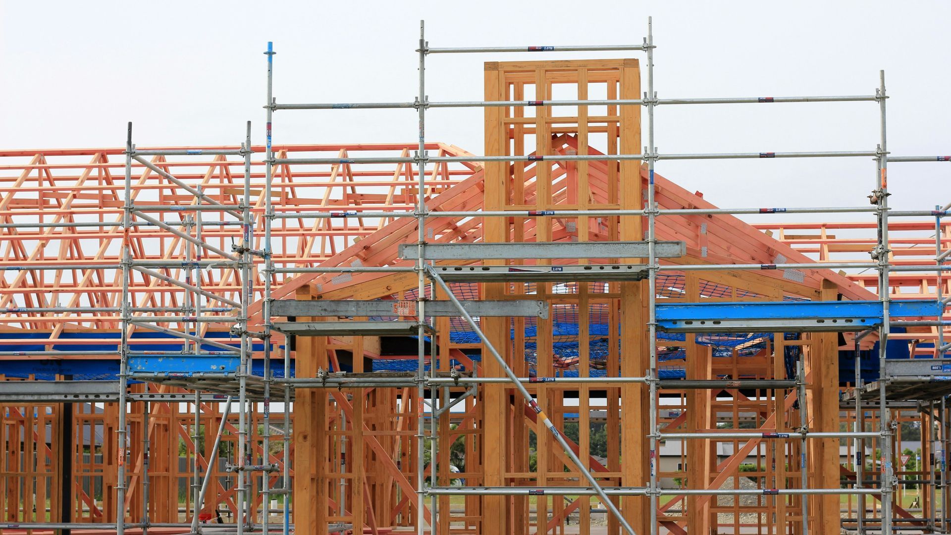 a house is being built with scaffolding around it .