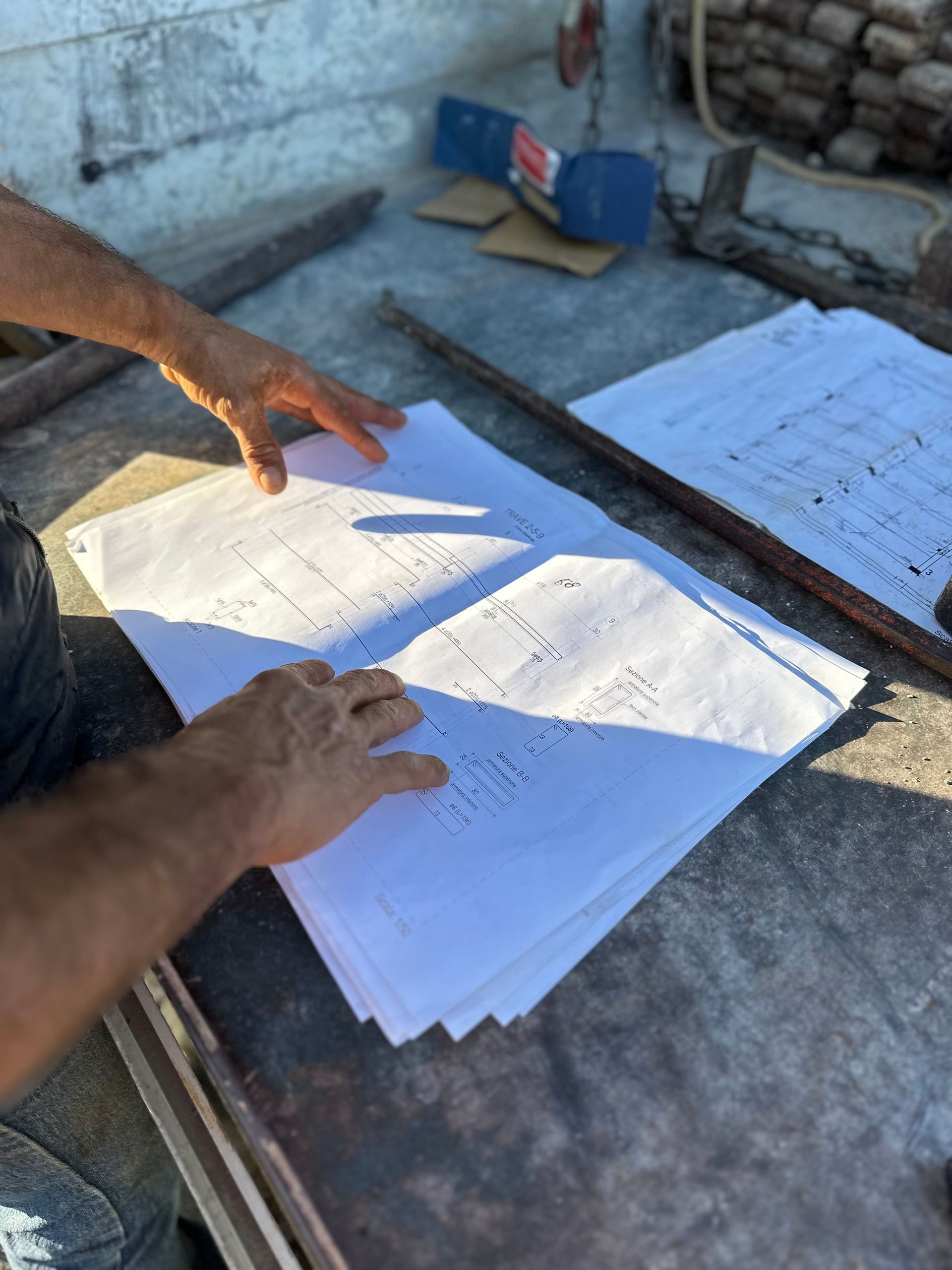 Licensed contractor reviewing building permit and blueprints for a Jacksonville, FL renovation project