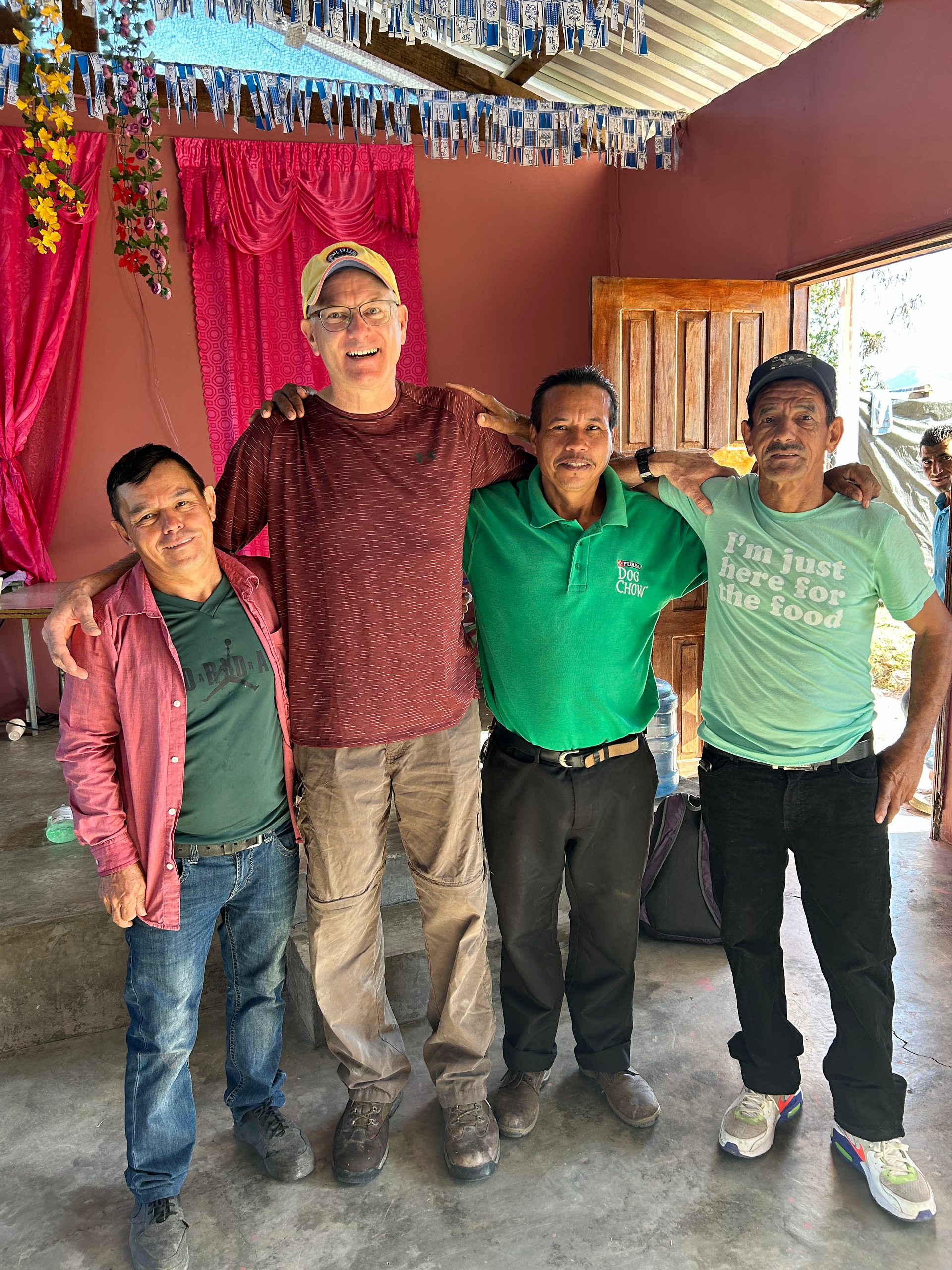 HTH team members stand arm in arm.
