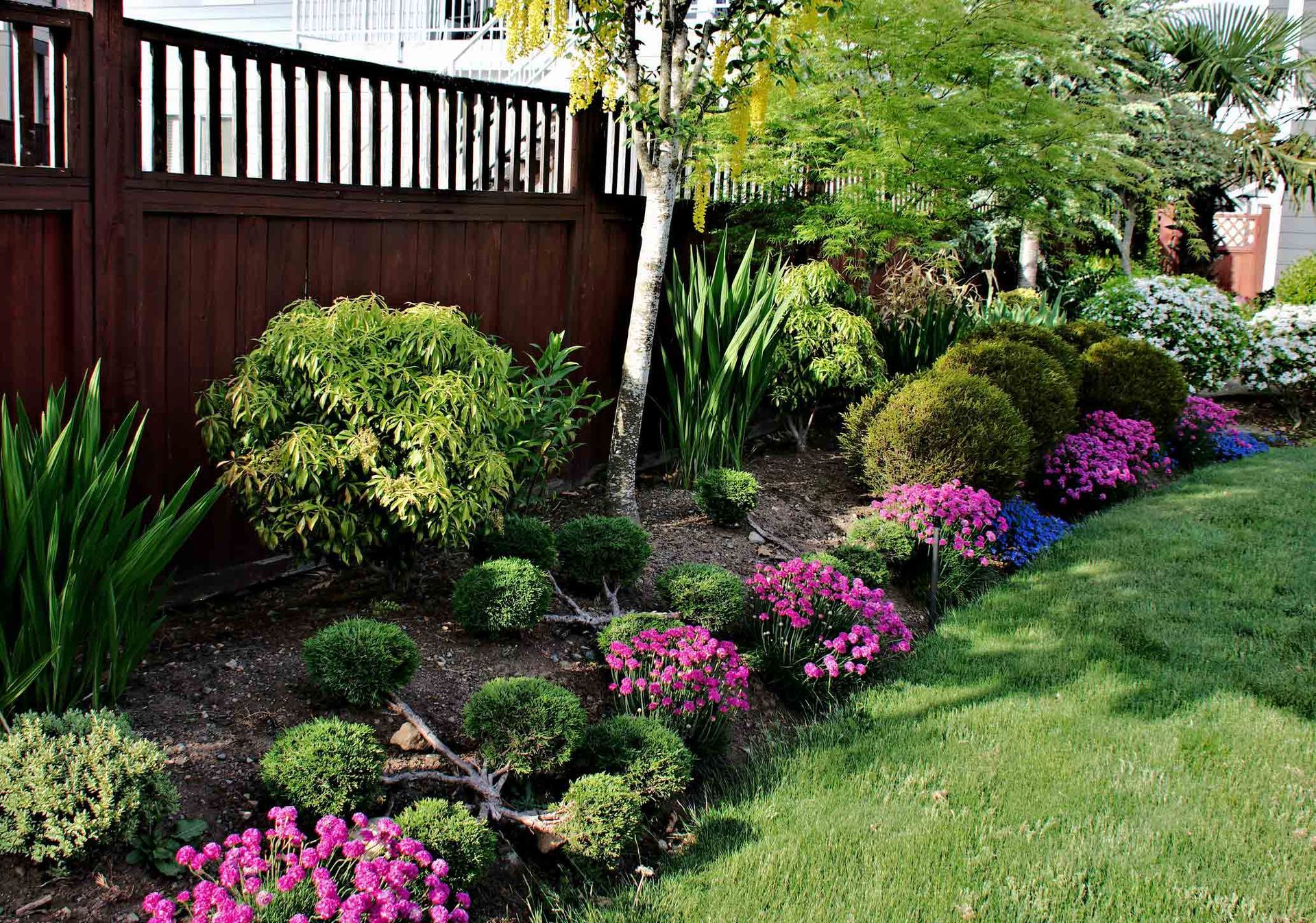 A Garden With A Wooden Fence And Lots Of Flowers — Brimfield, MA — RMD Services, Inc. A Garden With A Wooden Fence And Lots Of Flowers — Brimfield, MA — RMD Services, Inc.