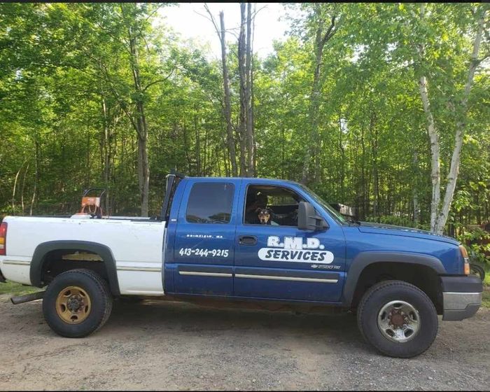 A Blue And White Truck With The Word Services On The Side — Brimfield, MA — RMD Services, Inc. A Blue And White Truck With The Word Services On The Side — Brimfield, MA — RMD Services, Inc.