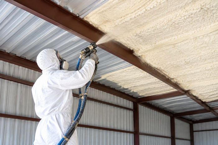 Spray foam applied to metal building ceiling