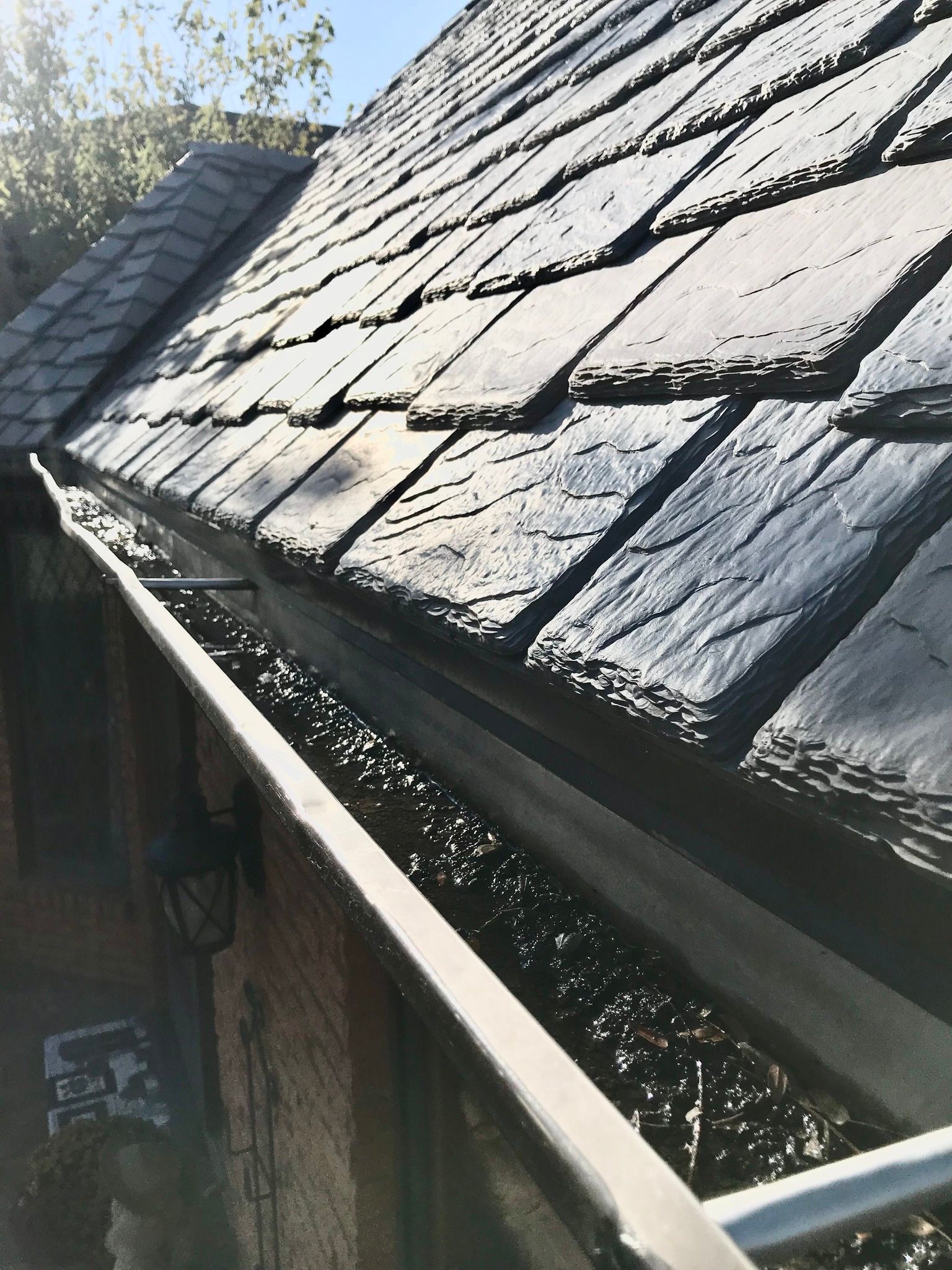a close up of a gutter on the roof of a house .