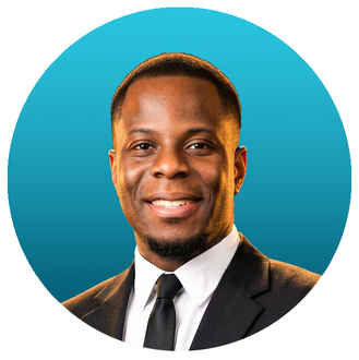 Smiling man in a blue suit and tie against a teal background