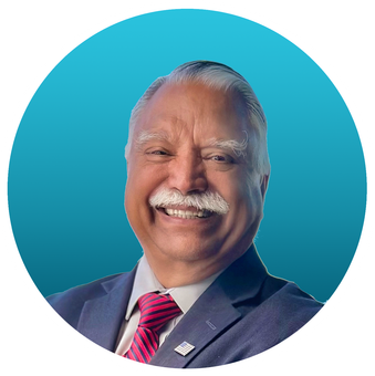 Portrait of a man in a suit and glasses against a teal background