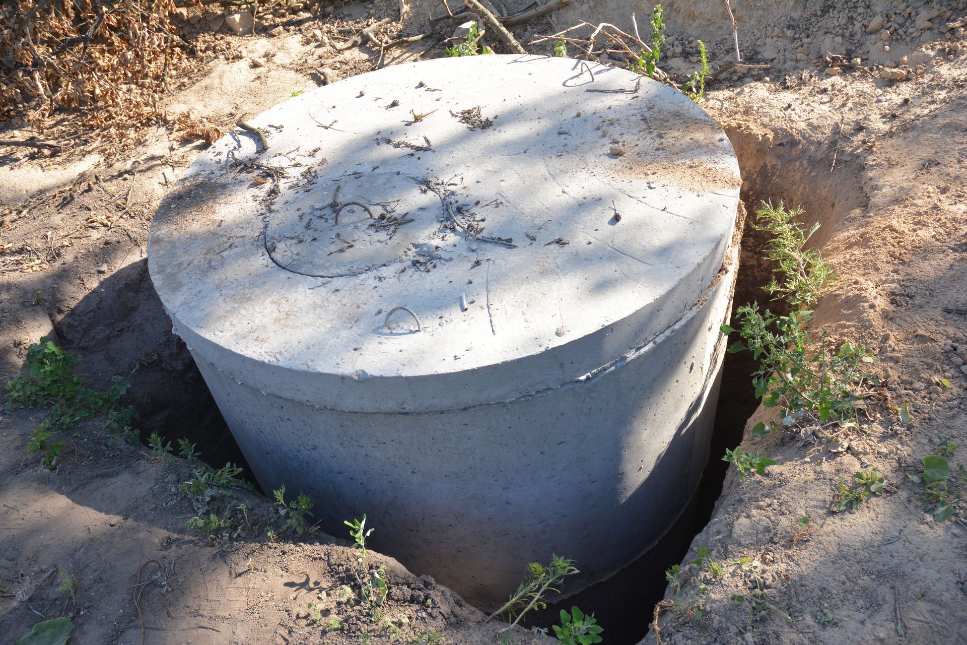 A Concrete Septic Tank is Sitting in the Middle of a Dirt Field — TCP Plumbing in Tabulam, NSW