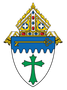 A shield with a green cross and a key on it