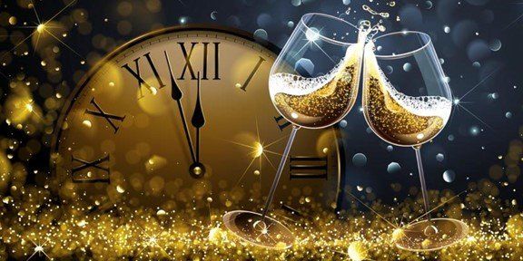 Two glasses of champagne are toasting in front of a clock.