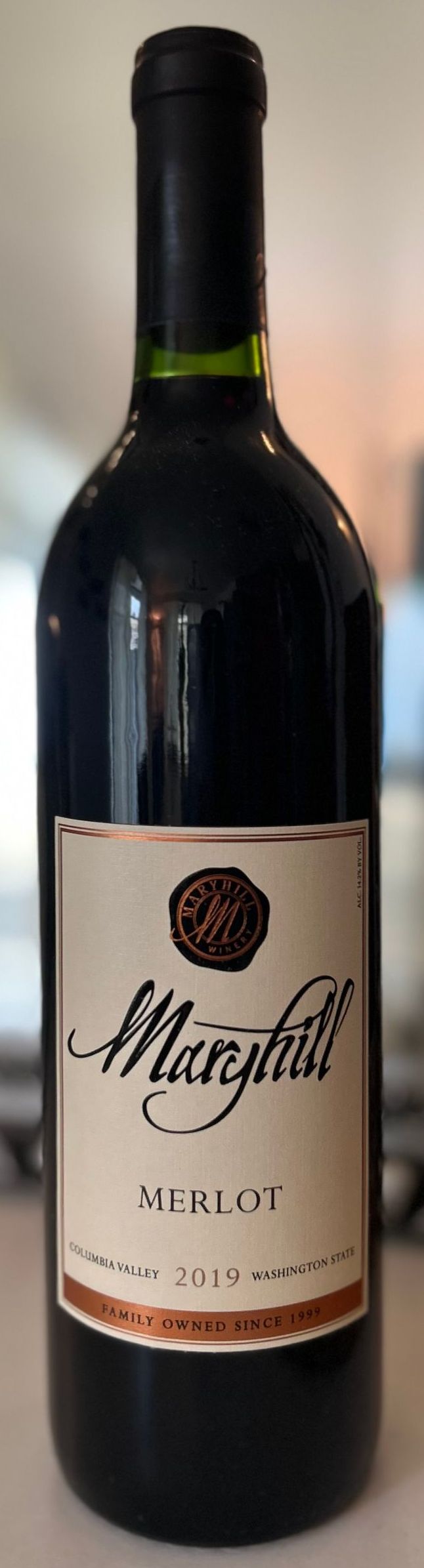 A bottle of marguerite wine is sitting on a table