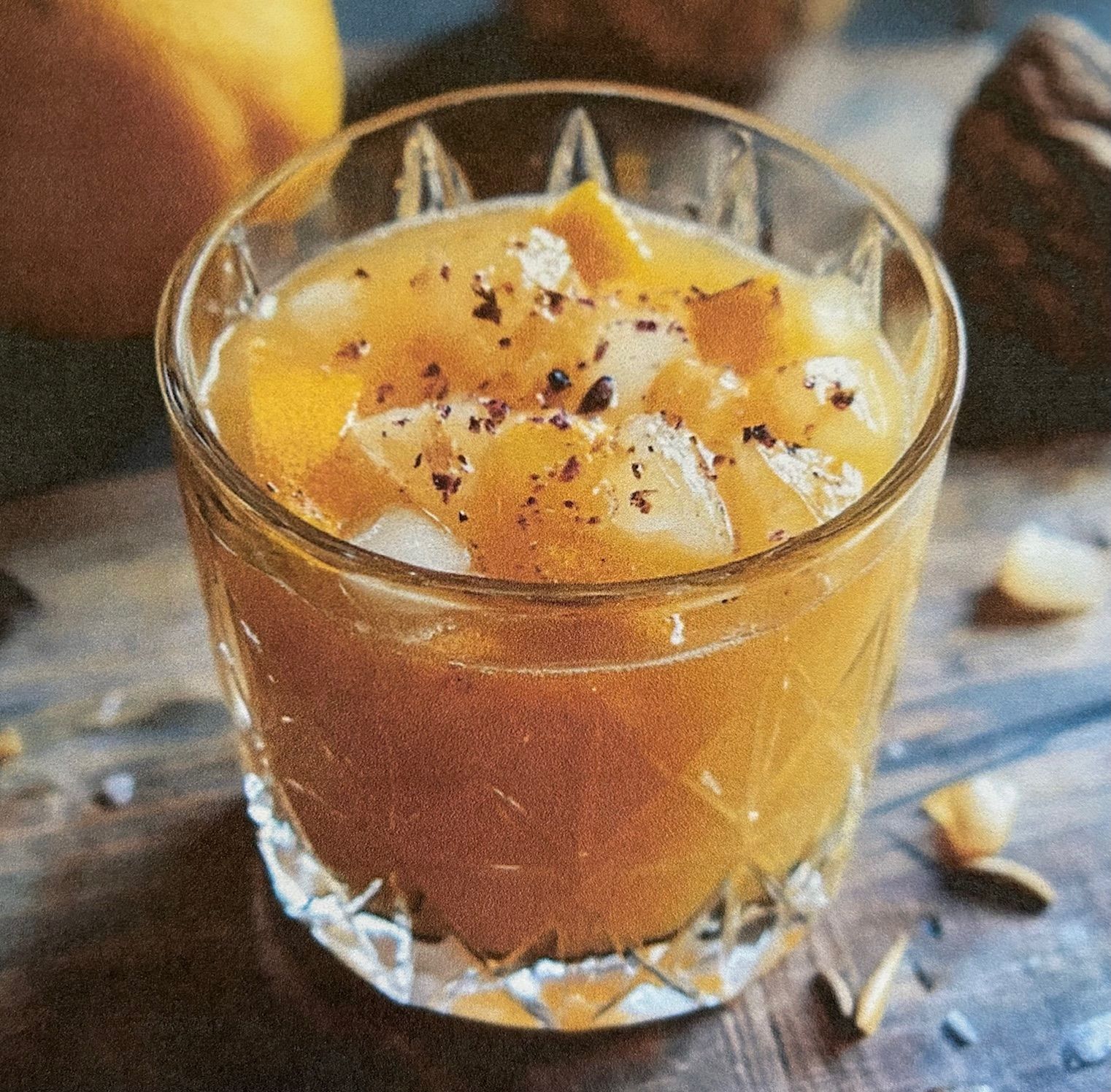 A close up of a glass of orange juice on a table