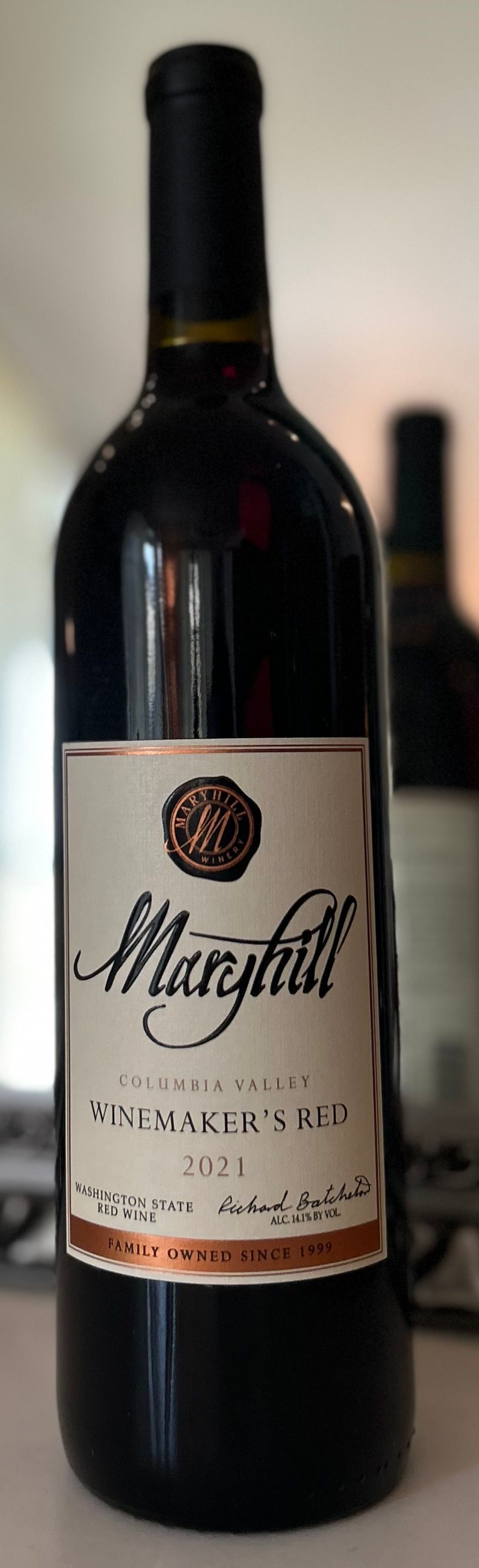 A bottle of marguerite wine is sitting on a table