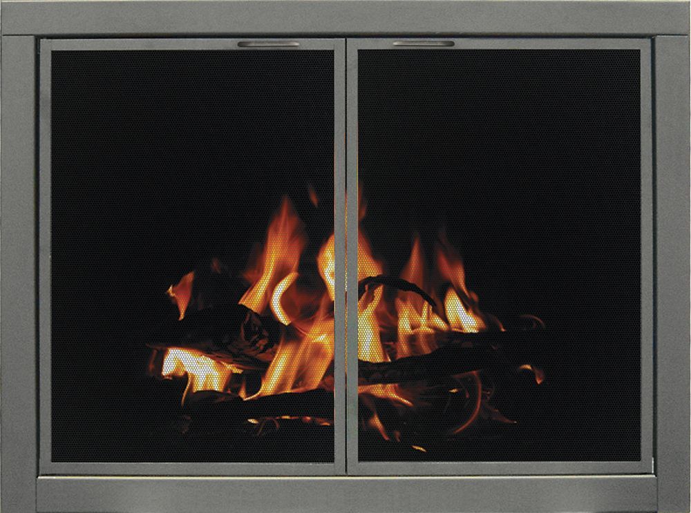 Fireplace with burning logs behind mesh screen doors. Orange flames against dark background.