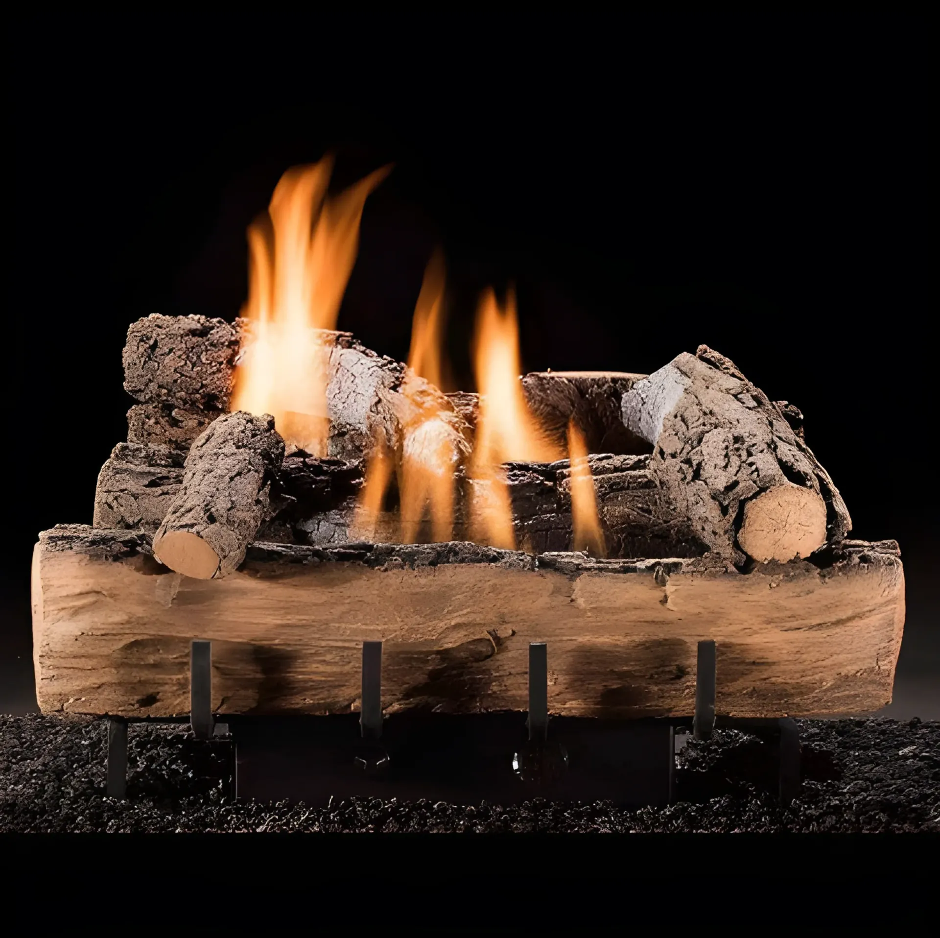 Gas fireplace with ceramic logs and orange flames against a black background.