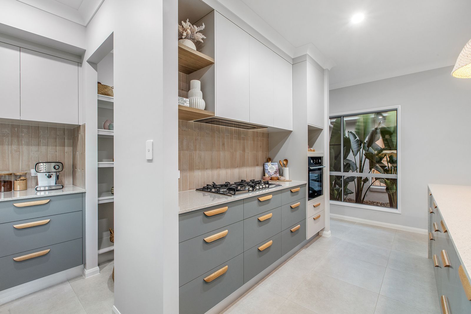 A Close Up Of White Cabinets With Black Handles — City Cabinetmakers in Sarina, QLD