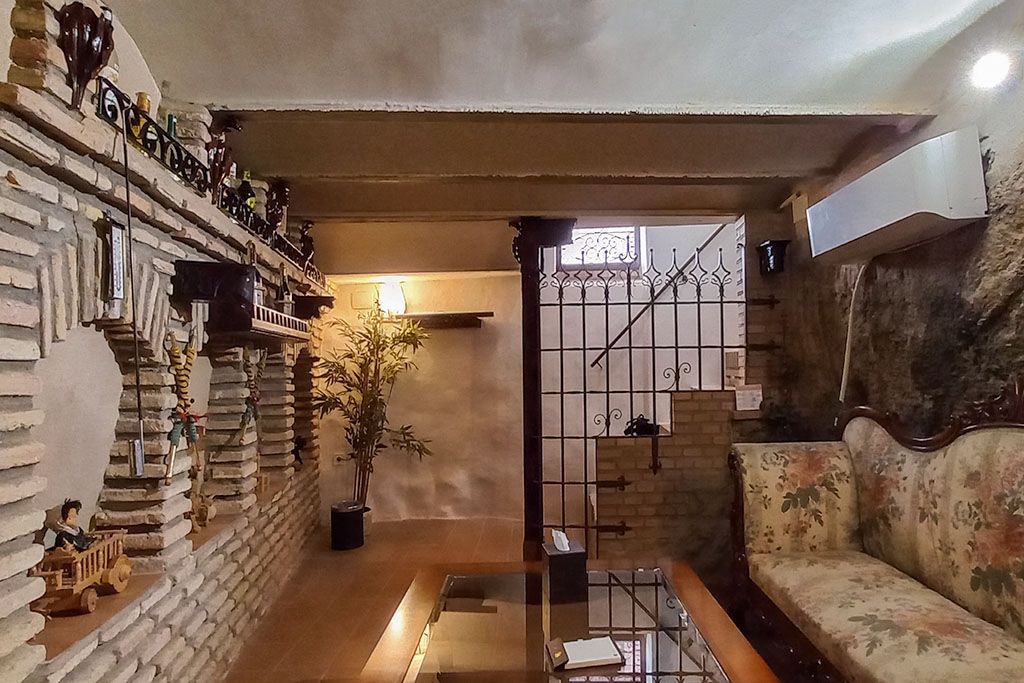A living room with a couch and a table