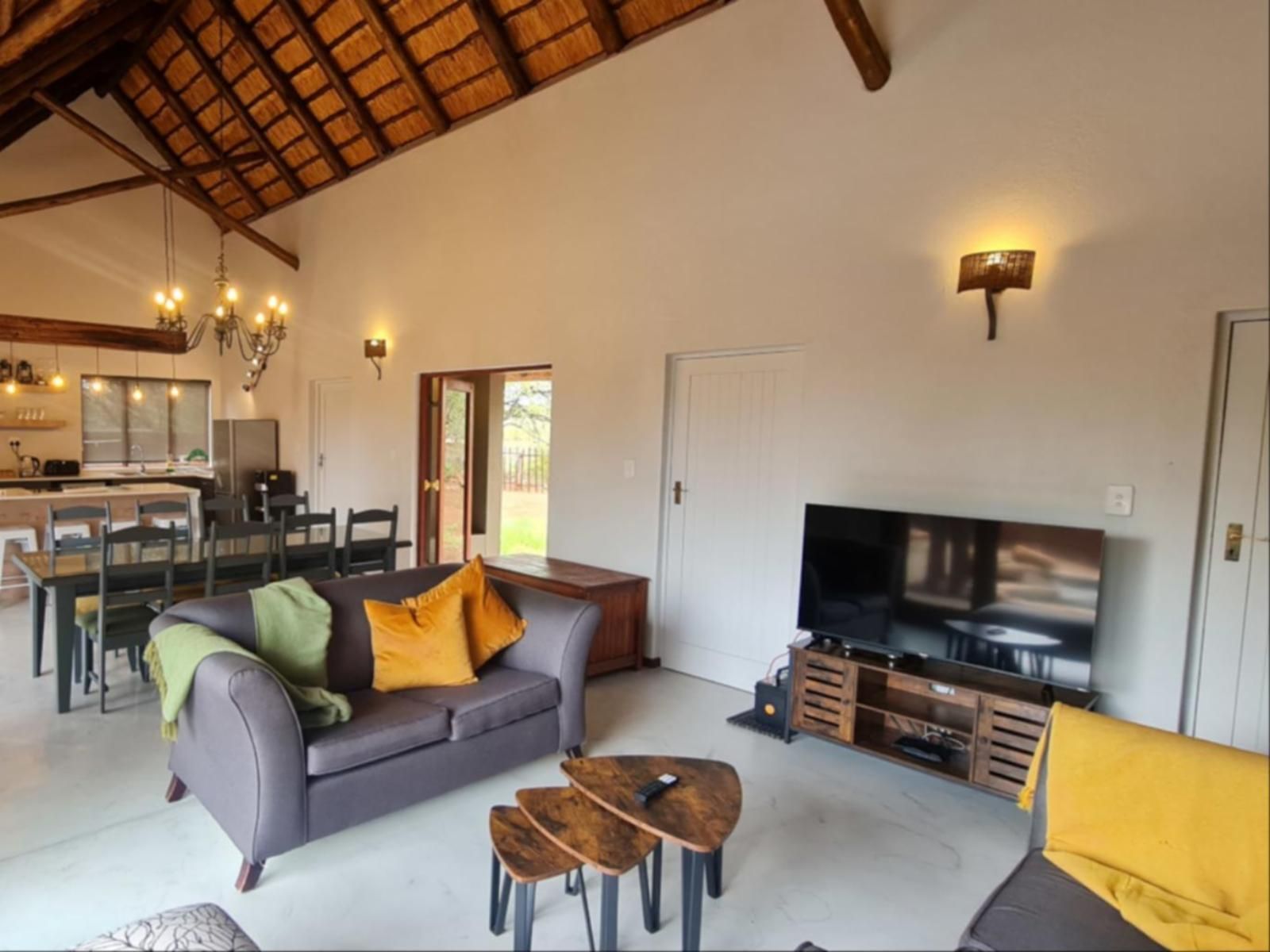 Africana | Hoedspruit Bush Stay living room with couches and tv