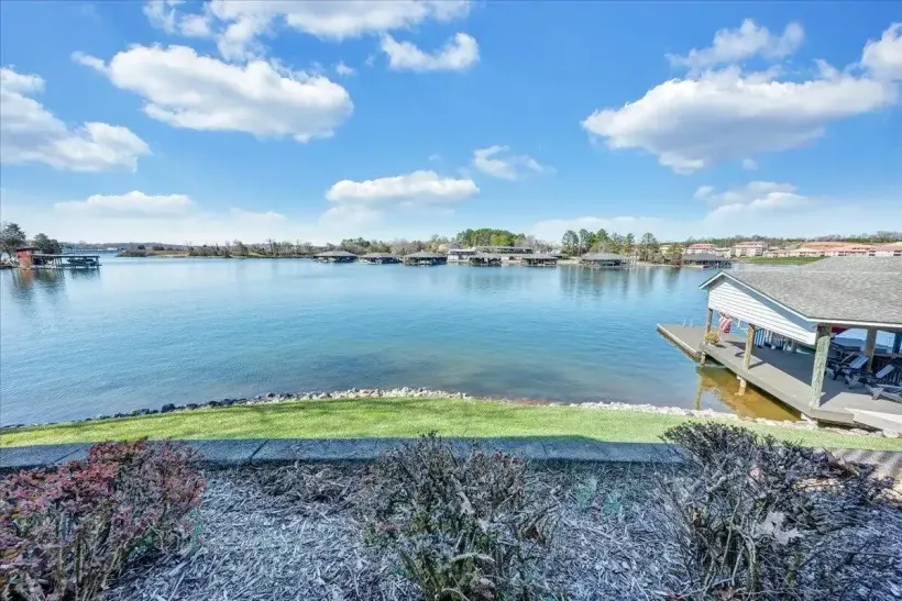 Calm lake view with shoreline and private dock