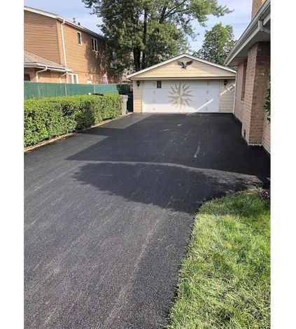 Bulldozer - commercial asphalt sealcoating in Oak Lawn, IL Bulldozer - commercial asphalt sealcoating in Oak Lawn, IL