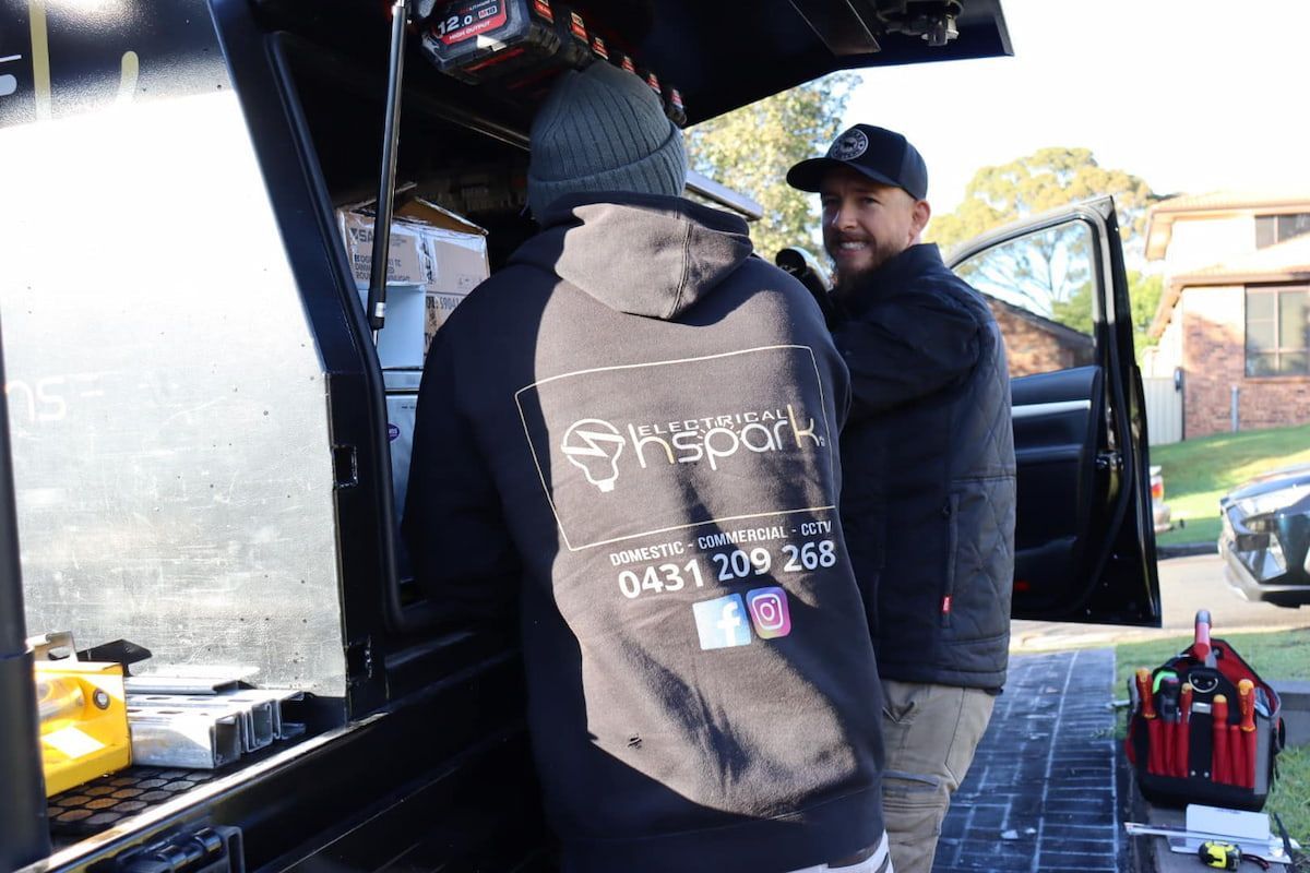 Two Men Near a Work Truck — Hspark Electrical PTY LTD in Camden, NSW