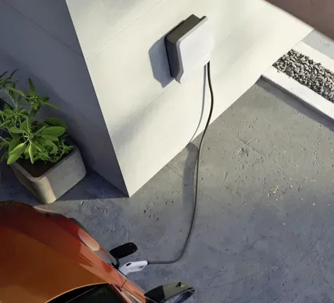 An Electric Vehicle Charger in a Garage — Hspark Electrical PTY LTD in Campbelltown, NSW