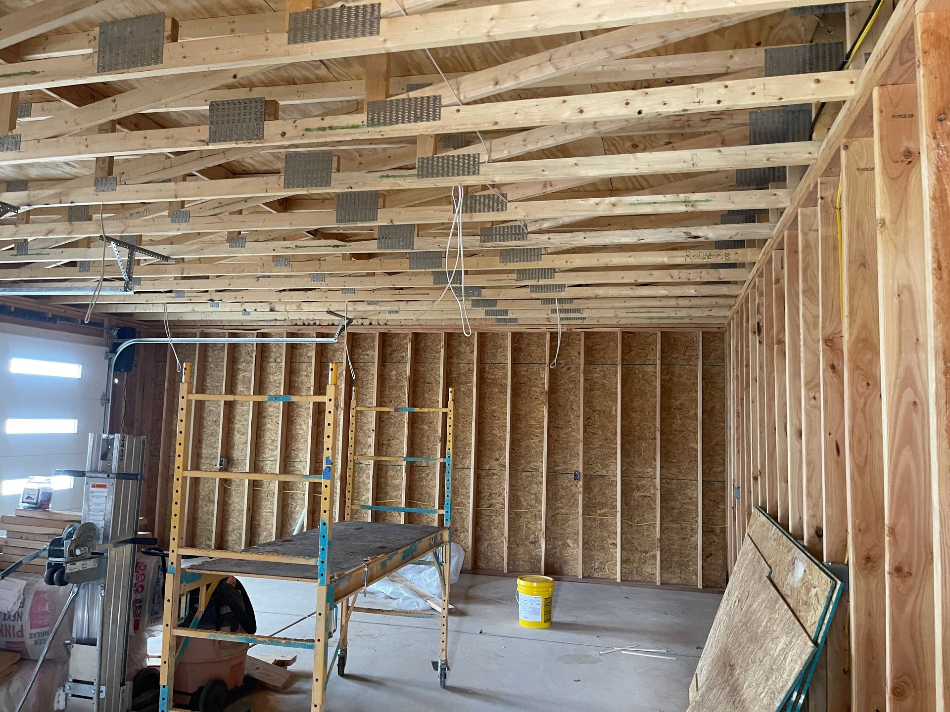Interior framing of new garage addition in Los Alamos NM home construction