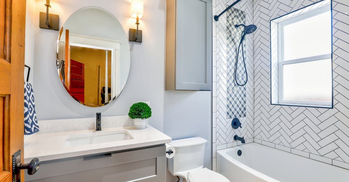 Custom white tile shower remodel with window and built-in storage – residential bathroom remodeling in Santa Fe, NM