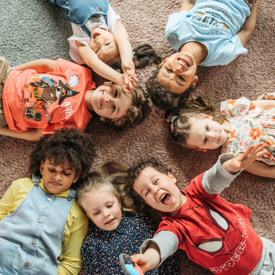 Diverse group of children of different abilities smiling and laughing, special needs dentistry in Tarrytown NY